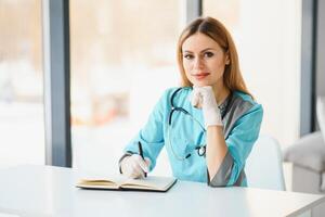 Portrait of beautiful female doctor looking at camera.Beautiful female doctor photo