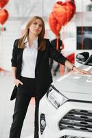 Salesperson selling cars at car dealership. photo