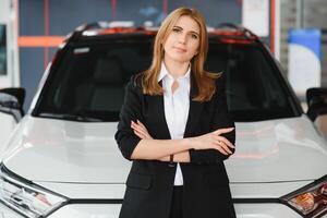 Salesperson selling cars at car dealership. photo