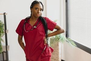 medicine, people and healthcare concept - african american female doctor or nurse at hospital. photo