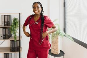 medicine, people and healthcare concept - african american female doctor or nurse at hospital. photo