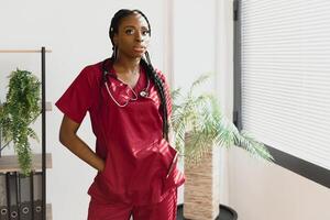 medicine, people and healthcare concept - african american female doctor or nurse at hospital. photo