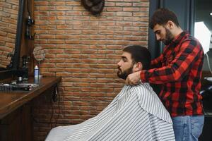 Men's haircut at the barber scissors. photo