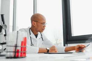 african american doctor in modern office photo