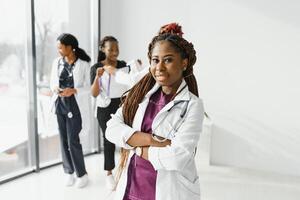 group of young african medical workers on white background. photo