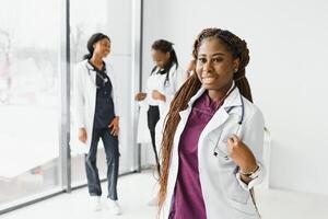 group of young african medical workers on white background. photo