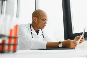 young male african doctor in hospital. photo