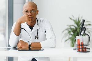 young male african doctor in hospital. photo