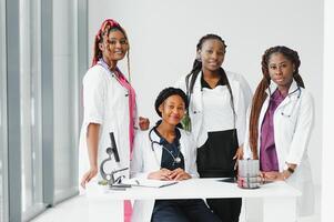 African-American black doctor woman and medical group. photo