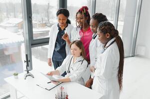 African-American black doctor woman and medical group. photo