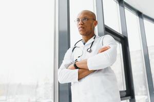 young male african doctor in hospital. photo