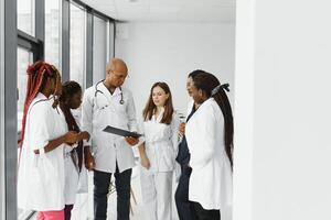 group of african american doctor and nurse in hospital ward. photo