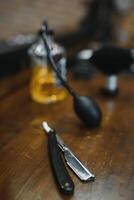 Vintage barber shop tools on old wooden background with copy space photo