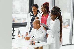 group of african american doctor and nurse in hospital ward. photo