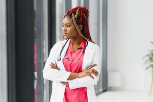 portrait of african female doctor at workplace. photo