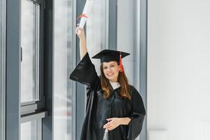 Portrait happy woman on her graduation day University. Education and people. photo