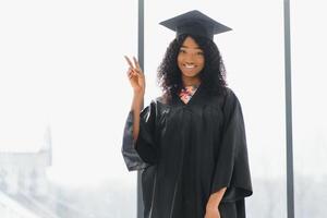 Excited African American woman at her graduation. photo