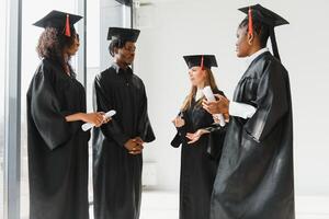 optimistic young university graduates at graduation photo