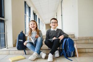 School kids in uniform together in corridor. Conception of education. photo