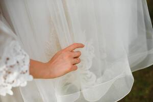 Bride dressing wedding gown. morning bride. photo