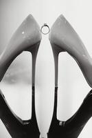 Wedding rings and high heels photo