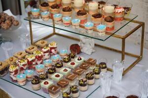 various dessert with fresh fruit on buffet line, sweet. photo