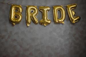 The inscription bride is laid out with balloons. photo