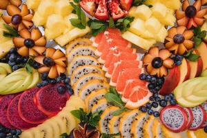 various dessert with fresh fruit on buffet line, sweet. photo