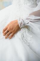 Bride dressing wedding gown. morning bride. photo
