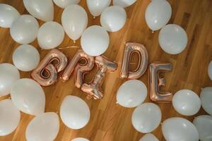 The inscription bride is laid out with balloons. photo