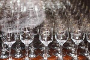 Set of empty glasses on table indoors photo