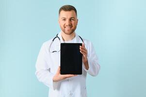 closeup of showing a tablet holding in hands by a male doctor who has a pretty smiley photo