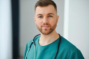 Young and confident male doctor portrait. Successful doctor career concept. photo