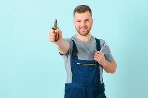 Portrait of a friendly worker. Isolated on blue photo