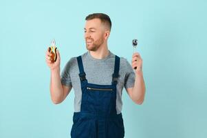 Portrait of a friendly worker. Isolated on blue photo