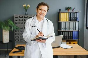 Portrait of a middle aged female doctor photo