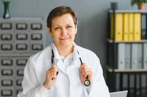 Portrait of a middle aged female doctor photo