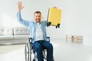 Young disabled man preparing for summer vacation photo