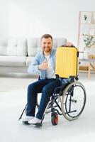 Young disabled man preparing for summer vacation. photo