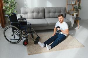 Disabled sportsman doing stretching and exercises on wheelchair background. Life of a disabled person photo