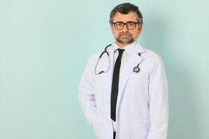 doctor ready to help patients with health problems, isolated on blue background with copy space. photo