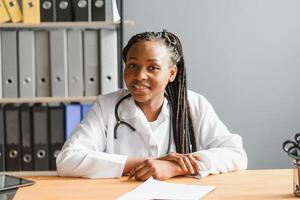 African female doctor talk with patient make telemedicine online webcam call. Woman therapist conferencing on computer in remote telemedicine laptop virtual chat. Telehealth concept. photo