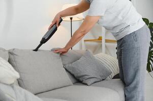 Middle-aged woman cleaning new apartment. photo