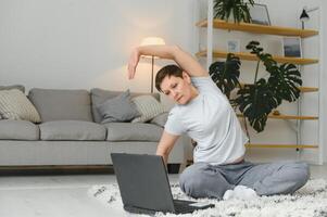 Middle age woman smiling happy doing exercise and stretching at home photo