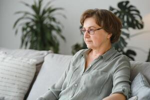 Close-up portrait of a older woman at home photo