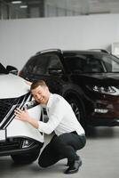 Man buying a car at a showroom photo