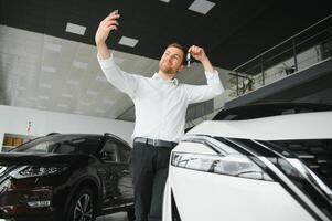 Man buying a car at a showroom photo