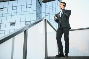 Portrait of an handsome businessman in an urban setting photo