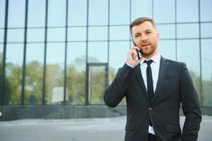 Portrait of an handsome businessman in an urban setting photo