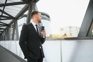 Portrait of an handsome businessman in an urban setting photo